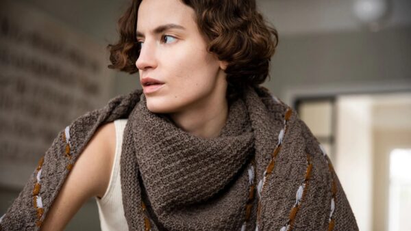 Lady wearing patterned knitted scarf