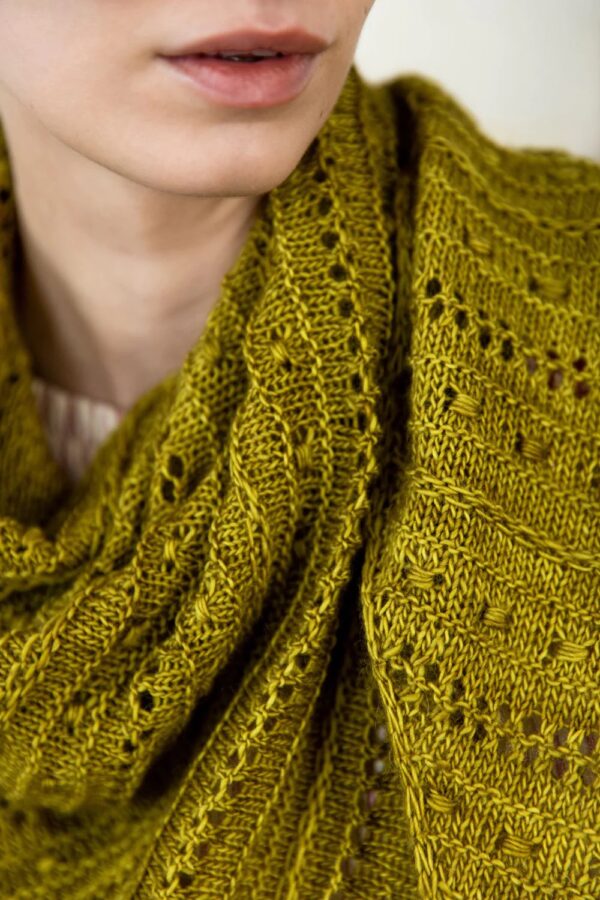Lady wearing textured knitted patterned scarf