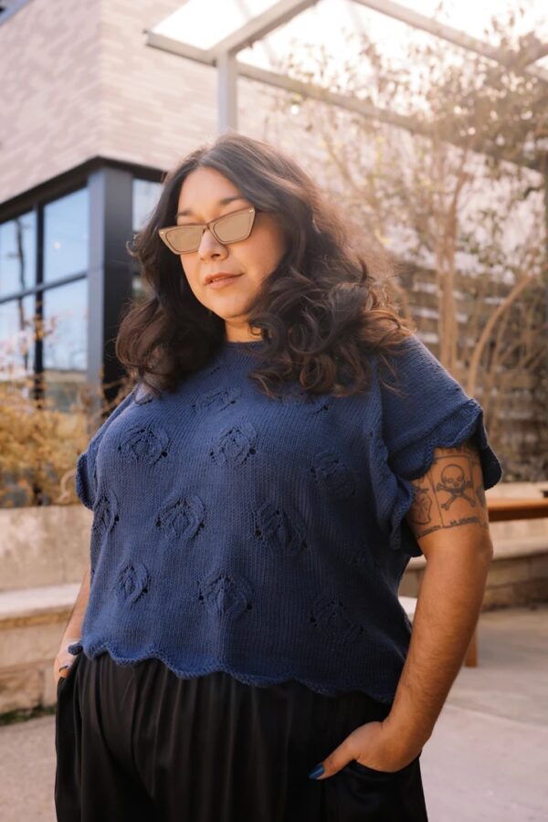 Lady wearing navy blue knit short sleeved top
