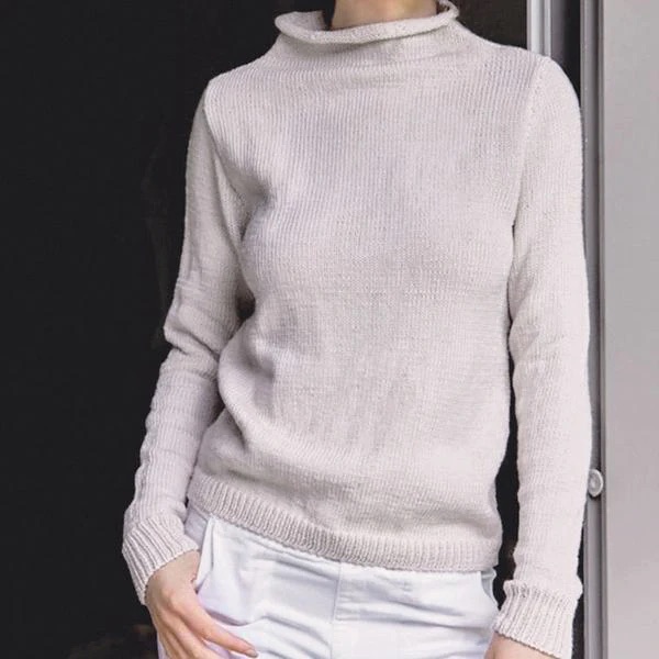Lady wearing cream high neck knitted jumper